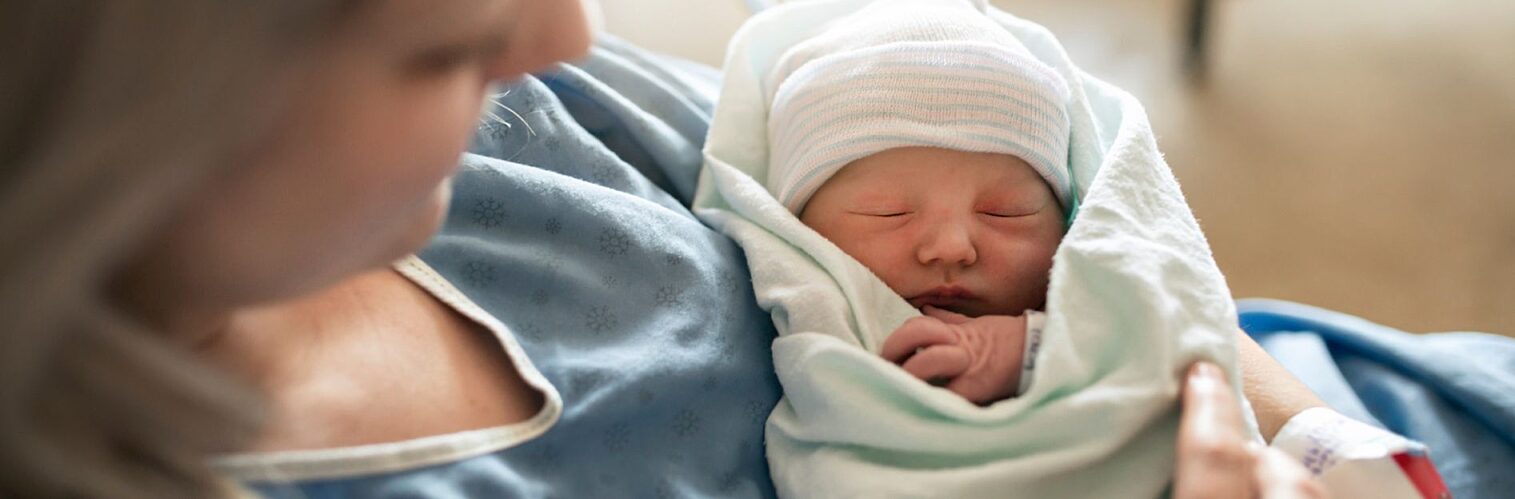 Mother with her newborn baby at the hospital.