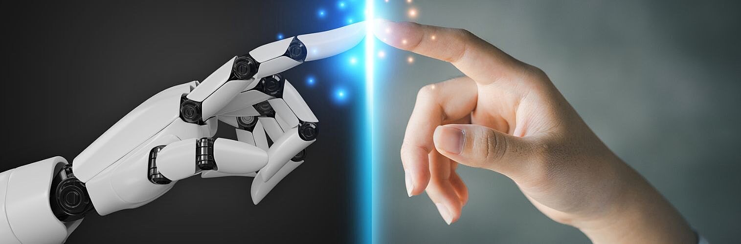 Robot and human hands pointing to each other.