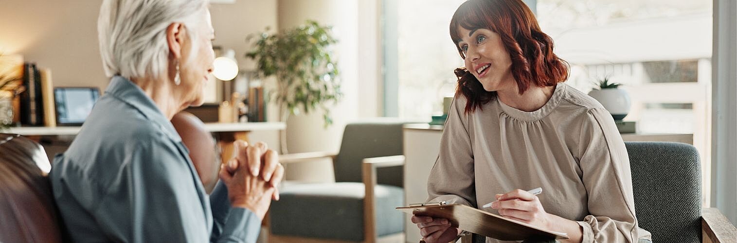 Senior woman and younger psychologist during for counselling.