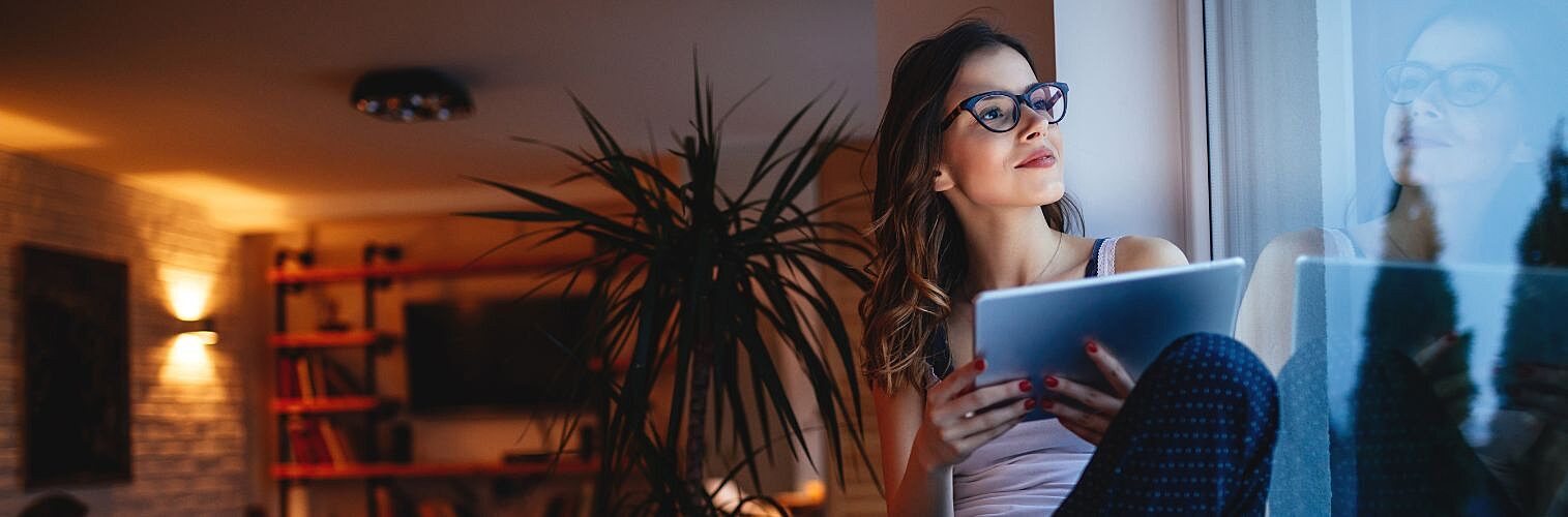 Woman using tablet at home.