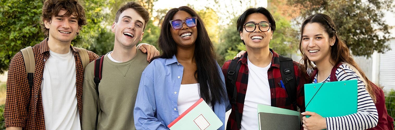 Happy students smiling together on campus.