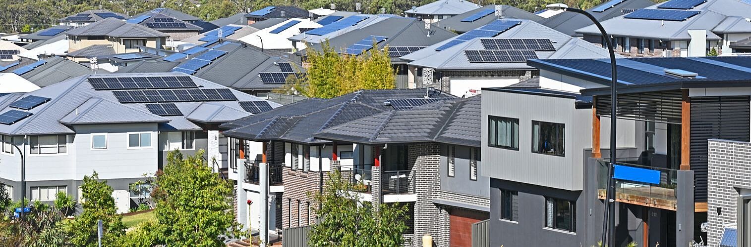 View of suburban houses showing how many have solar panels.