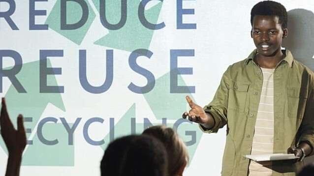 A man giving a presentation about recycling