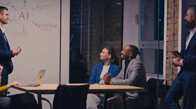 Diverse business team discussing artificial intelligence in a modern office at night.