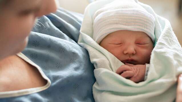 Mother with her newborn baby at the hospital.