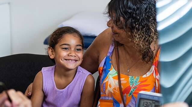 A young Aboriginal girl gets a check-up at the doctor’s surgery.