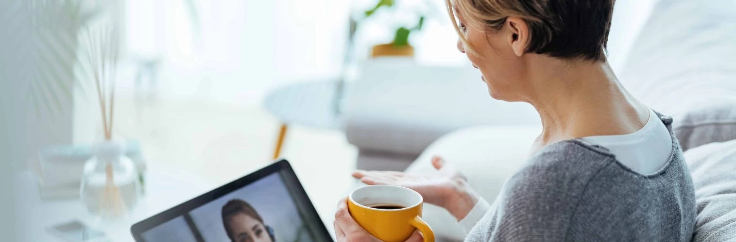 Woman at home on virtual call to doctor