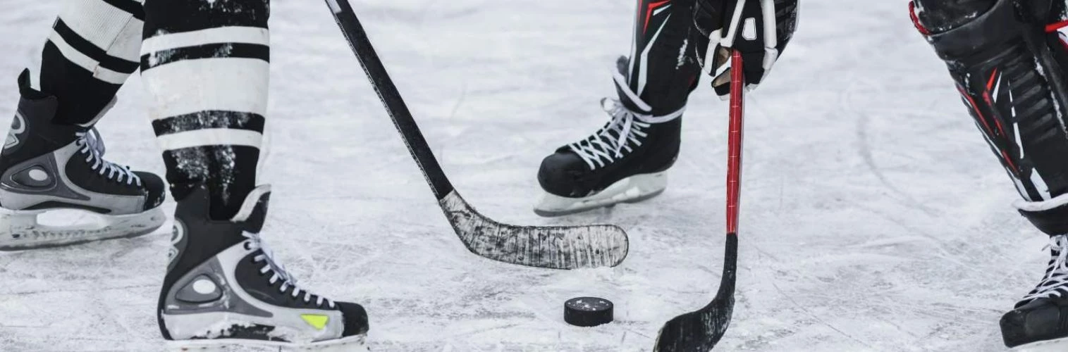 Close up of ice hockey players legs