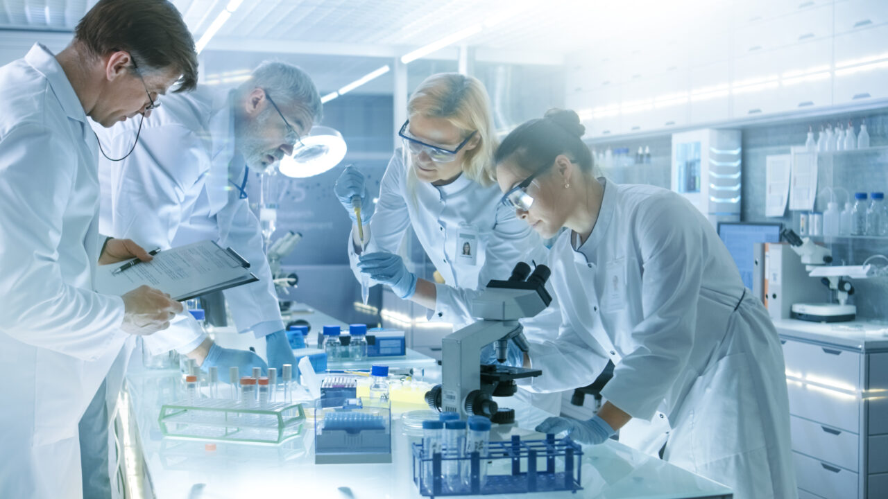 A team of medical research scientists work on a new generation disease cure.